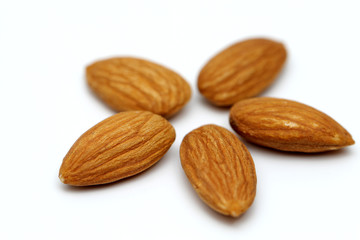 Almonds isolated. Group of almond nuts isolated on white background. Full depth of field