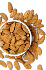 Almond mamra giri isolated. Group of almond nuts isolated on white background. Full depth of field