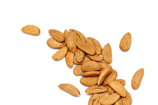 Almond mamra giri isolated. Group of almond nuts isolated on white background. Full depth of field