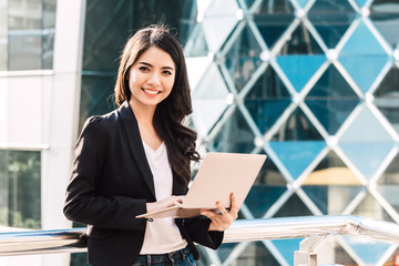 Happy successful businesswoman using a laptop computer