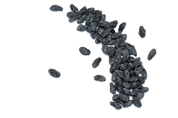 black raisins on white background
