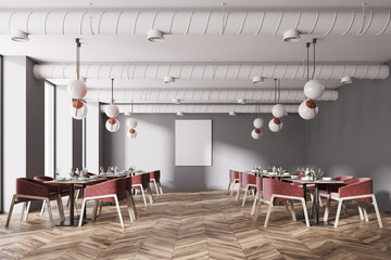 Red chairs loft cafe with a poster