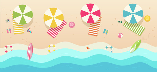 Beach, top view with umbrellas, towels, surfboards, sunglasses, hats, ball.