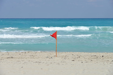 Fototapeta na wymiar Flag on the beach.