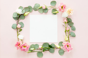 Naklejka na ściany i meble Square flower frame of wreath with pink inflorescence, buds, branches and eucalyptus green leaves isolated on light background, top view flat lay