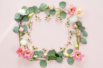 Pink roses on white background. Flat lay. Frame wreath