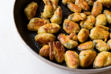 Fried Crispy Mussels Cooked in Pan.
