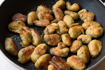 Fried Crispy Mussels Cooked in Pan.