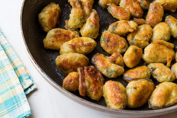 Fried Crispy Mussels Cooked in Pan.