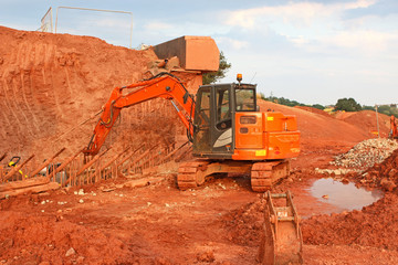 Obraz premium Digger on a road construction site