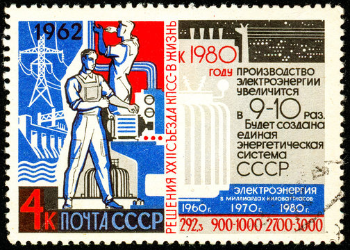 Ukraine - circa 2018: A postage stamp printed in USSR show propaganda poster Electric industry and statistics. Forecast until 1980. Series: Resolution of 22nd Communist Party Congress. Circa 1962
