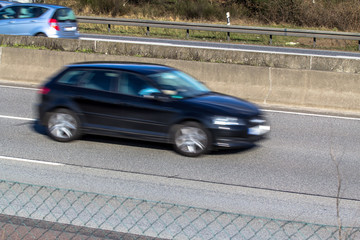 Fototapeta na wymiar A car driving on a motorway