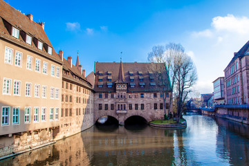 Obraz premium View of the Heilig-Geist-Spital (Hospice of the Holy Spirit) in the old Town of Nuremberg, Germany.