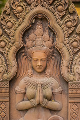 Fototapeta premium Stone carving Stucco Women Antiques based on the Hindu belief. In ancient Cambodia, Thailand, Indonesia and Laos.