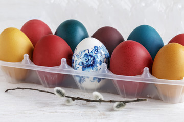 The painted eggs in a container