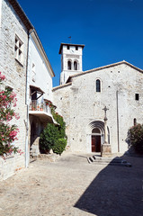 Fototapeta na wymiar The stone medieval church Saint-Pierre-aux-liens of Ruoms.