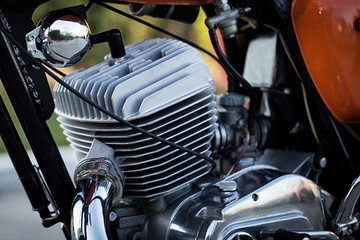 engine motorcycle produced in the USSR under the name IZH a close-up. Chromed exhaust pipe