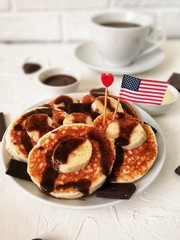 American independence Day, celebration, patriotism and holidays concept-cheesecakes and coffee with flags and stars on 4th of July party on wooden background