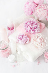 bath and spa with peony flowers beauty products towels