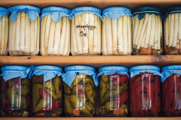 Obraz na płótnie Canvas Greek homemade jam and canned food on the shelves of local shops