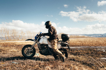 Fototapeta na wymiar dirty motorcycle on the road in motion