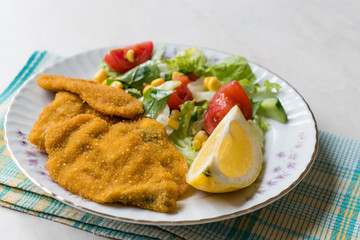 Fried Crispy Sardine Fish Plate with Salad and Lemon / Seafood Sardalya