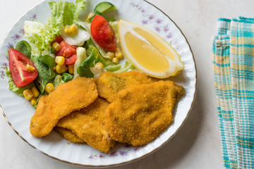 Fried Crispy Sardine Fish Plate with Salad and Lemon / Seafood Sardalya