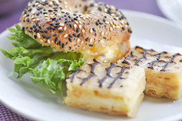 bread or cake with chocolate topping and cheese burger