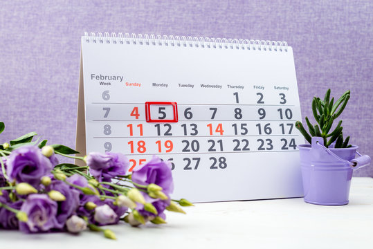 February 5 mark on the calendar on purple background