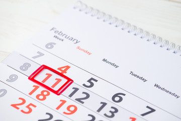 DAY OF WINTER SPORTS. February 11 mark on the calendar, close-up