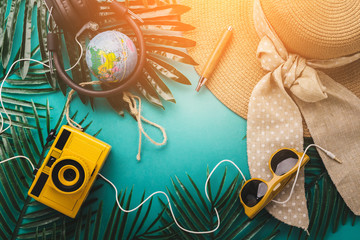 summer vacation and travel concept with travel stuff camera notebook glasses and woman hat flatlay...