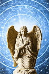 angel archangel Gabriel with divine light over blue mystical background 