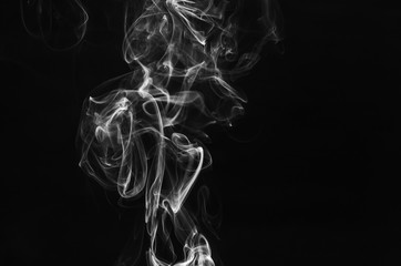 white smoke incense isolated on black background.