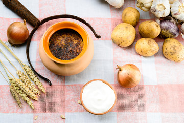 Traditional Belarusian and Ukrainian Cuisine. Potato babka, baked cake made of potato, meat and onion on the food pot. Top view, flat lay