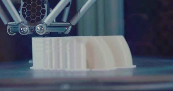 Close up of industrial automation and robotic engineering, in which the robot or mechanical arm build industrial parts. Concept of: robotics, engineering, technology and industry.