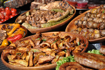 street food feast. baked potatoes with fried mushrooms