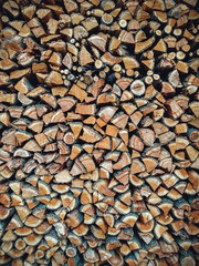 Copy spase. Texture. Different types of firewood in the stack