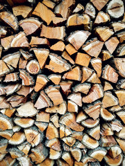 Copy space. Ends of logs wooden background. Wood in the stack.