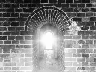 Ancient arches in China. Black and white color in high contrast with flare light. Use as background, backdrop, or montage in vintage style, or visual content for historical and architectural topics.