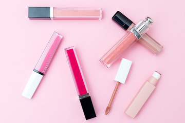 Lip gloss on a pink background. Geometric style