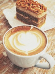 Latte art coffee with cake