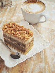 Latte art coffee with cake
