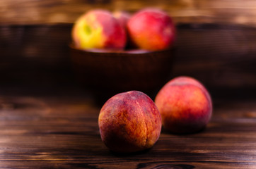 Fototapeta na wymiar Fresh ripe peaches on wooden table