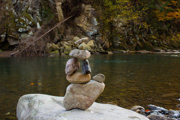 a stone figure on the river bank