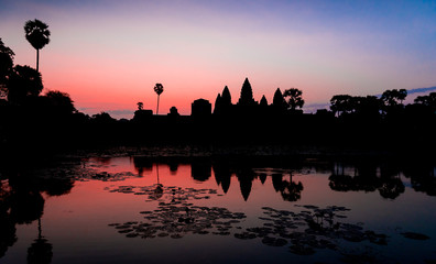 Fototapeta premium Amazing sunrise view of Angkor Wat temple complex in Cambodia and the largest religious monument in the world. Location Siem Reap, Cambodia. Artistic picture. Beauty world. Ancient Khmer architecture