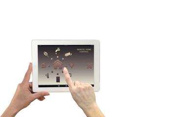 Smart remote home control system on a digital tablet. Woman hands holding device with app icons.