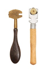 Two vintage glass cutters on white background