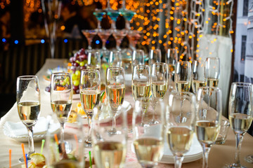 Line of glasses with champagne at the furshet