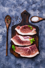 Three raw pieces of meat