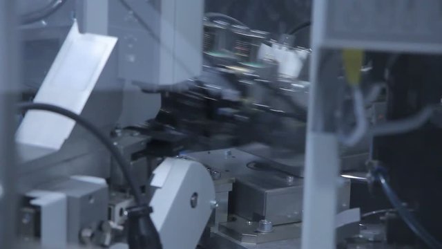 The robot performs a task in the automotive industry